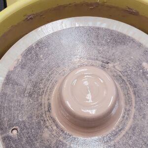 picture-of-clay-after-being-centered-on-a-potters-wheel-bat-at-first-beginnger-pottery-class
