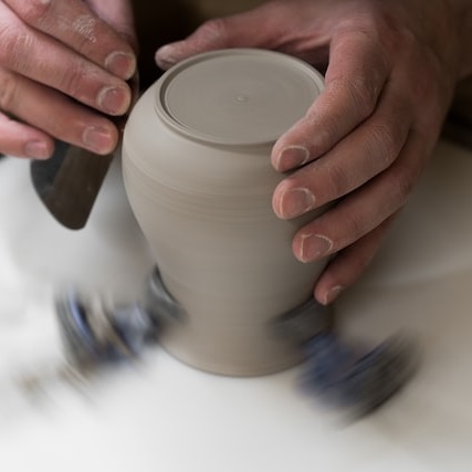 potters-hands-shaping-a-finished-form-on-the-wheel-pottery-tips-for-beginners